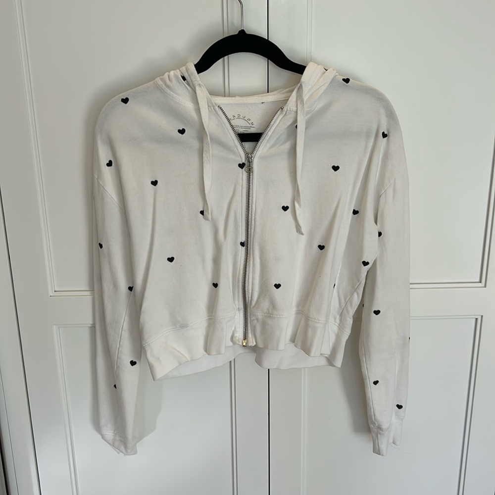 White zip up with black heart in size small